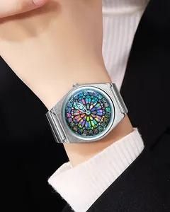 Close-up of artistic stained glass dial watch with silver steel strap on model's wrist