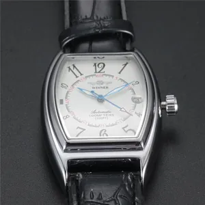 Close-up of WINNER men's tonneau mechanical watch with silver case and blue hands