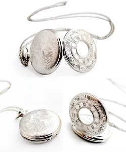 Detailed close-up views showing the intricate engravings on a silver vintage pocket watch