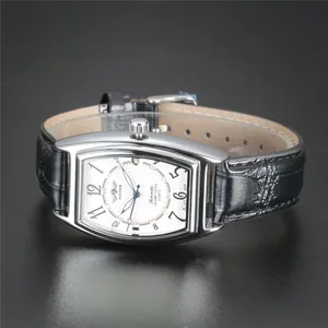 Detailed macro view of WINNER tonneau automatic mechanical watch with white dial