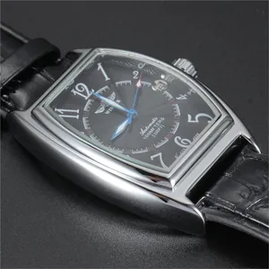 Close-up of WINNER men's tonneau automatic mechanical watch dial and steel case