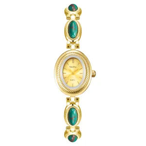 Montre bracelet de luxe vintage pour femme en or avec incrustations style turquoise