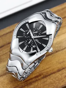 Close-up of a Y2K style men's watch featuring a silver wavy case and black chronograph dial
