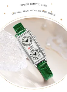 Gros plan d'une montre à quartz pour femme avec bracelet en cuir vert et double cadran.