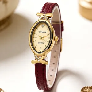 Close-up of elegant women's oval quartz watch with burgundy leather strap