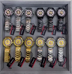 Close-up of men's watches featuring rotating roulette dials in various metal finishes.