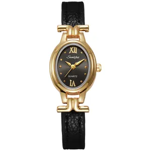 Close-up view of elegant women's quartz watch with oval gold case and black strap