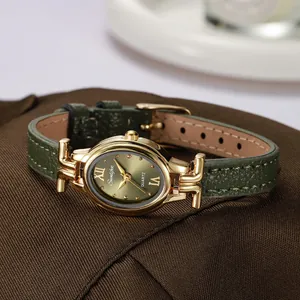 Elegant women's oval quartz watch featuring a vintage green dial and leather strap
