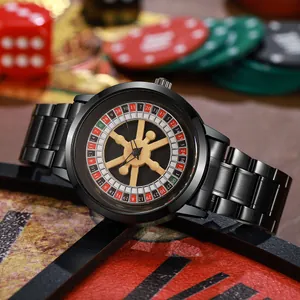 Macro view of the rotating roulette dial and golden ship's wheel hand on a black watch