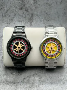 Detail shot of men's roulette wheel rotating dial watches in black and silver