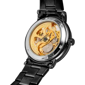 Detailed view of Forsining 9005 golden mechanical skeleton movement in black steel watch
