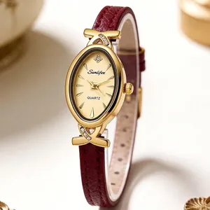 Elegant ladies quartz watch featuring an oval gold-tone case and a burgundy leather strap