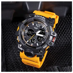 Detailed view of SMAEL 8008 sports watch with orange strap and digital-analog display.