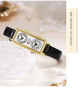 Gros plan d'une montre rectangulaire élégante pour femme à double cadran et cuir.