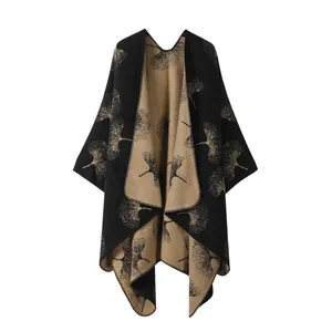 Detailed view of fall winter faux cashmere knit poncho with artistic ginkgo leaf pattern