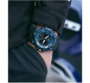 Close-up of SMAEL 8008 rugged sports watch with dual time display and blue accents.