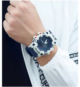 Macro detail of SMAEL 8008 digital sports watch worn on wrist over white jacket