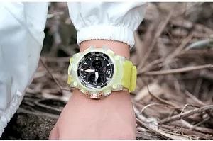 Close-up of SMAEL 8008 fluorescent yellow sports watch worn outdoors for students.