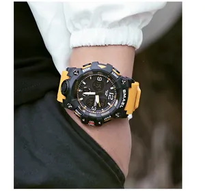 Detailed close-up view of a rugged SMAEL 8008 sports watch with yellow strap on wrist
