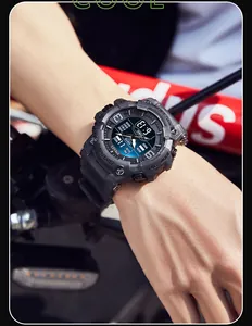 Close-up of SMAEL men's dual display waterproof sports watch worn on the wrist.