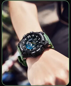 Close-up view of SMAEL men's sports waterproof digital watch with a green strap.