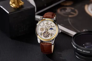 Close-up detail of AOKULASIC men's automatic watch with skeleton tourbillon dial