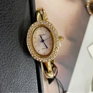 Elegant oval SUNLIFEX women's watch in gold with sparkling diamond bezel.