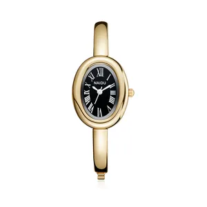 Vintage gouden bangle horloge voor dames met zwarte wijzerplaat en Romeinse cijfers