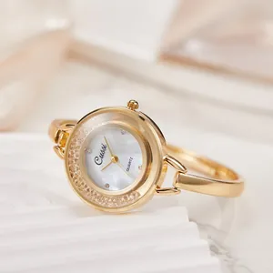 Orologio rigido da donna color oro con quadrante in madreperla e cristalli.