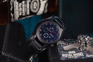 Large dial KTEVI rugged men's sports watch with black leather cuff strap and red accents