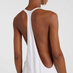Elegant white backless maxi dress featuring a deep racerback design for summer wear.