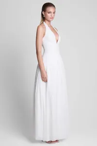 Professional full body studio shot of a white sleeveless gown with plunging V-neck.