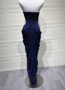 Detailed back view of a navy blue strapless dress with elegant lace-up corset design