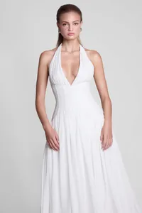 Elegant white French halter neck backless evening gown detail worn by a fashion model