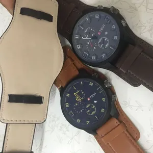 Detailed view of KTEVI oversized men's watch with wide brown leather strap