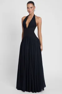 Detailed view of the dark navy halter neck maxi dress with deep V-neck and pleats