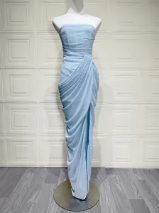 Elegant light blue strapless maxi dress featuring draped pleats and a high side slit