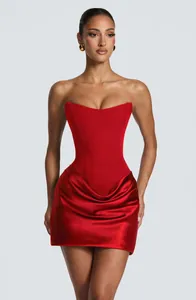 Detailed view of an elegant red strapless corset dress with a draped satin mini skirt