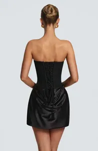 Back view detail of sexy black corset dress with satin pleated skirt for evening party