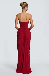 Elegant red strapless evening maxi dress featuring a corset back and ruched detailing.