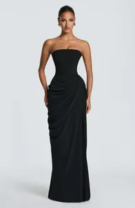 Elegant black strapless evening gown featuring ruched detailing and a sophisticated slim fit.
