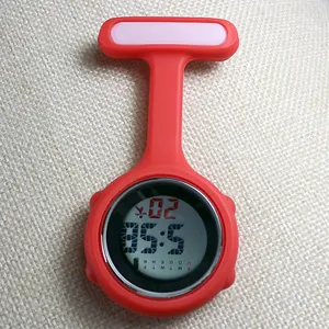 Detailed macro view of a red silicone medical nurse fob watch featuring a digital display
