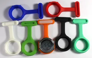 Close-up of colorful silicone nurse watches with digital LCD display and pin-on attachment.