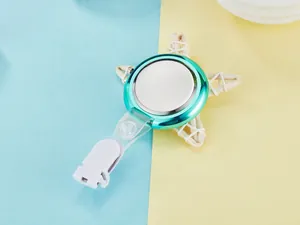 Close-up of fashionable teal quartz nurse watch featuring a white retractable clip