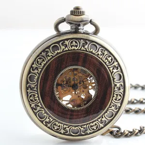 Close-up detail of a vintage bronze skeleton mechanical pocket watch with wood inlay.