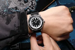 Close-up detail of AOCASDIY men's sport watch with black silicone strap on wrist