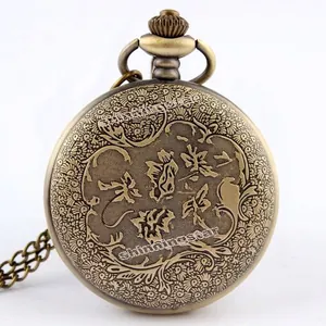 Reloj de bolsillo vintage de bronce con grabado floral y cadena clásica larga