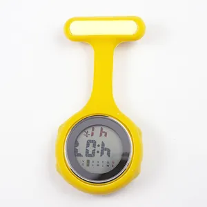 Detail view of a bright yellow digital silicone nurse fob watch with a pin-on attachment
