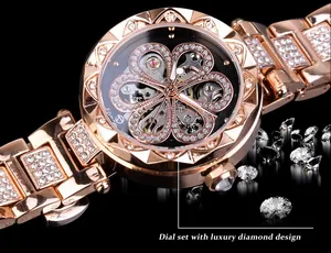 Detailed view of the luxury skeleton dial featuring a rhinestone clover design on a rose gold watch