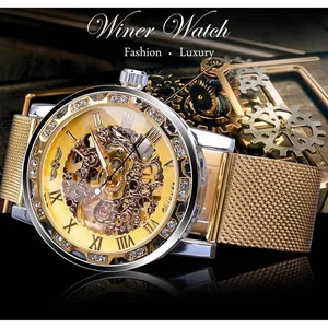 High-quality detail view of a luxury gold skeleton mechanical watch with a mesh strap.